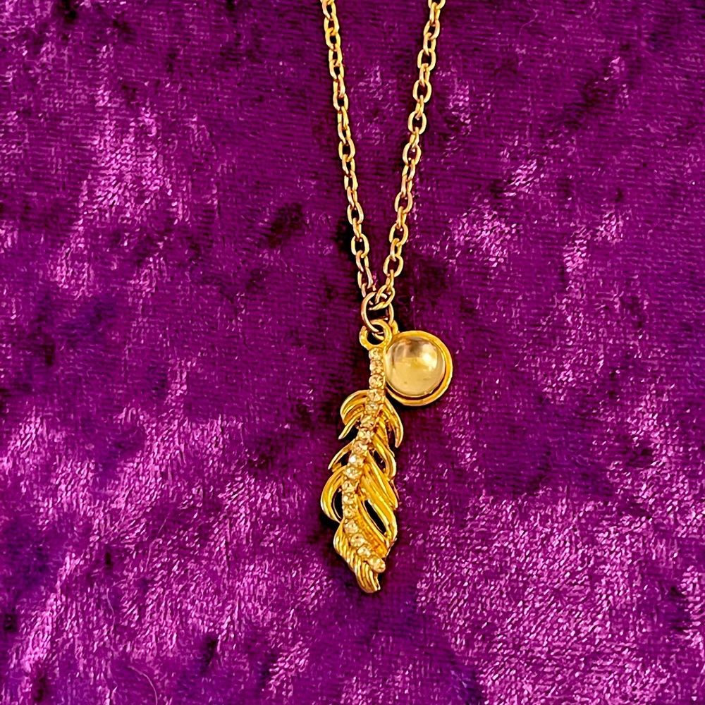 Gold pearl and feather necklace